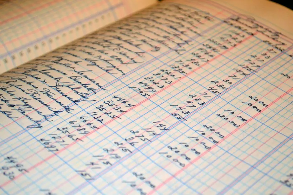 Close-up of a handwritten ledger book page used for record-keeping