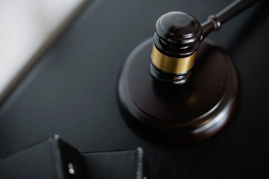 Close-up of a wooden judge's gavel on a courtroom desk